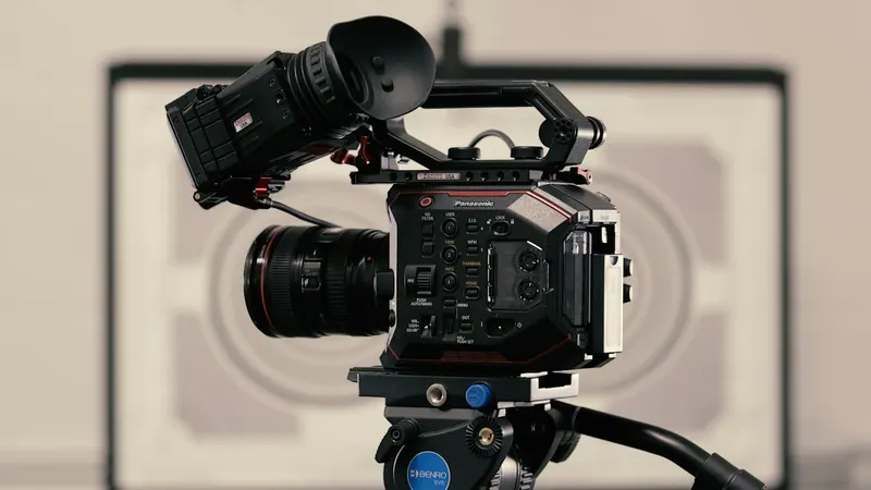 Professional cinema camera on a fluid head tripod, video production equipment