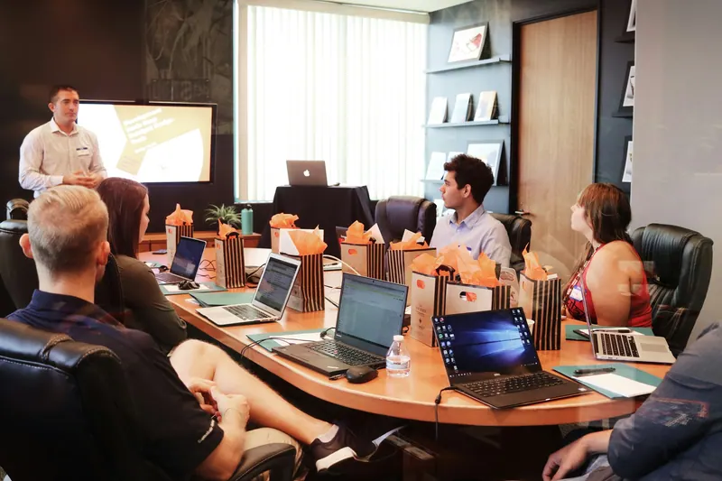 Presenter leading a corporate training session in a conference room, training video production