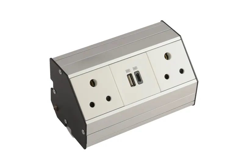 Brushed aluminium desktop power module with sockets and dual USB ports on white