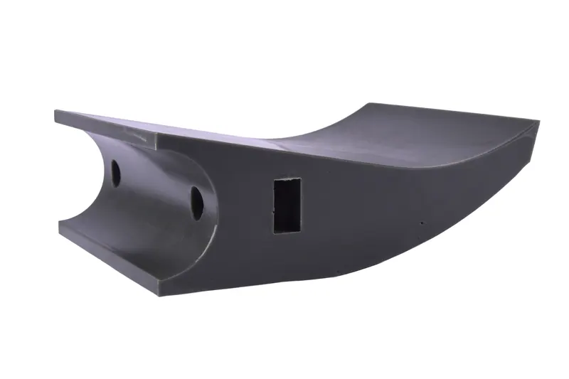 Black moulded plastic bracket with cut-outs photographed at a low angle on white