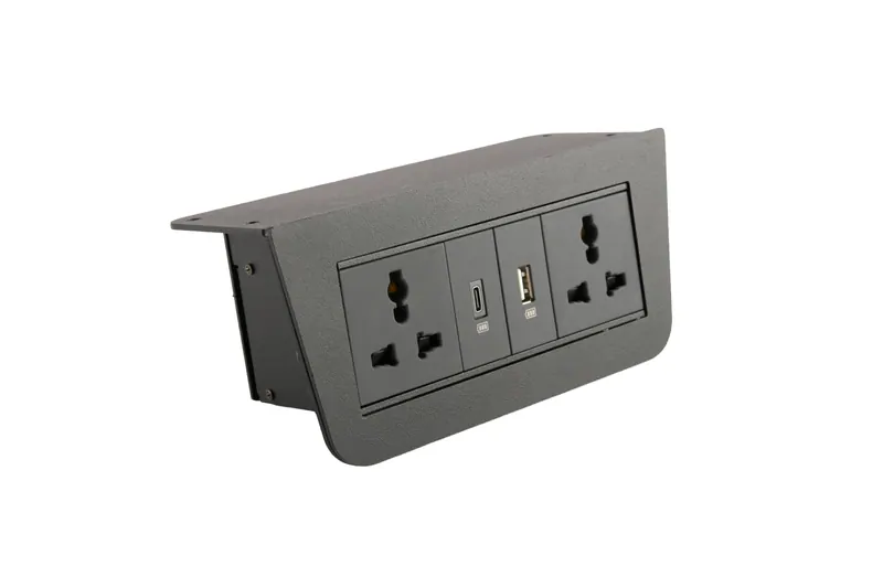Black recessed desktop power socket with universal outlets and USB ports on white, 360 degree product photography in Pune