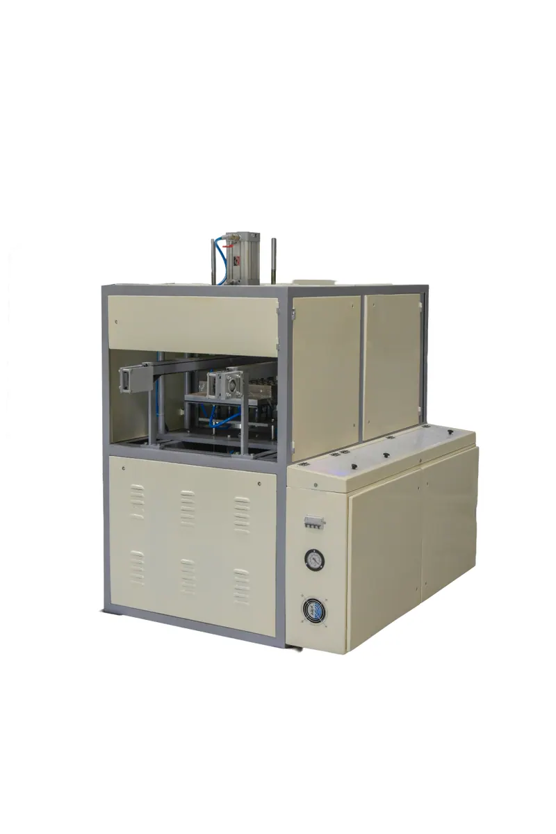 Compact industrial machine unit with beige panels and control dials isolated on a white background