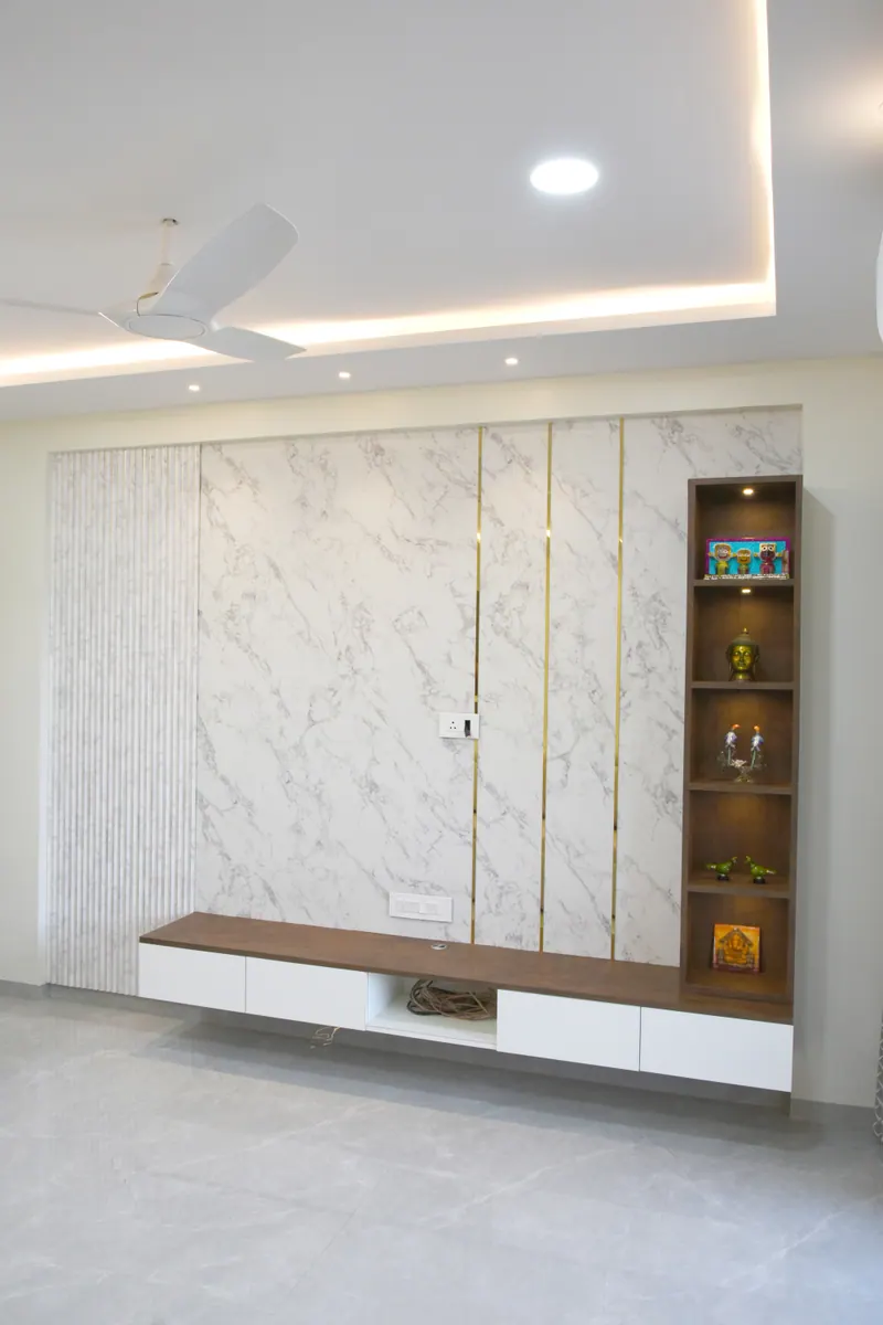 Marble effect television wall with a floating walnut unit and display niche, interior and real estate photography in Pune