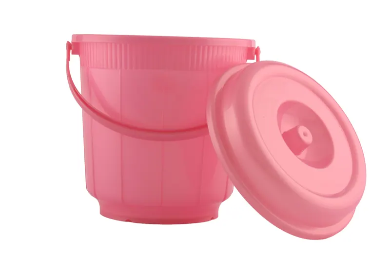 Pink plastic bucket with a handle and matching lid on white, e-commerce product photography