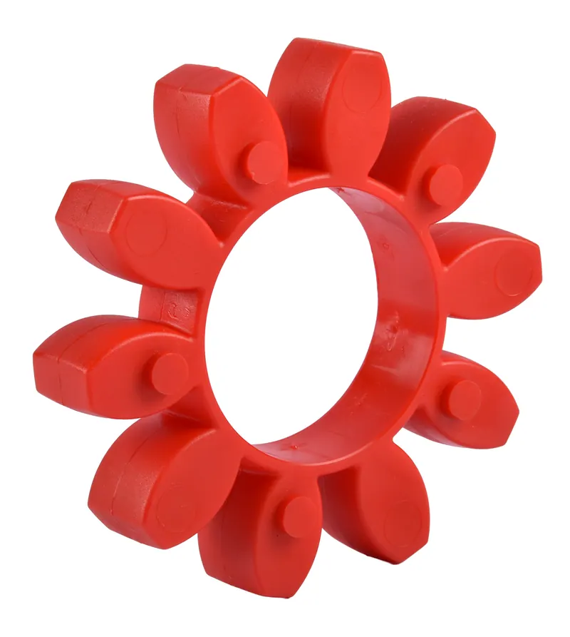 Red polyurethane jaw coupling spider element photographed on white