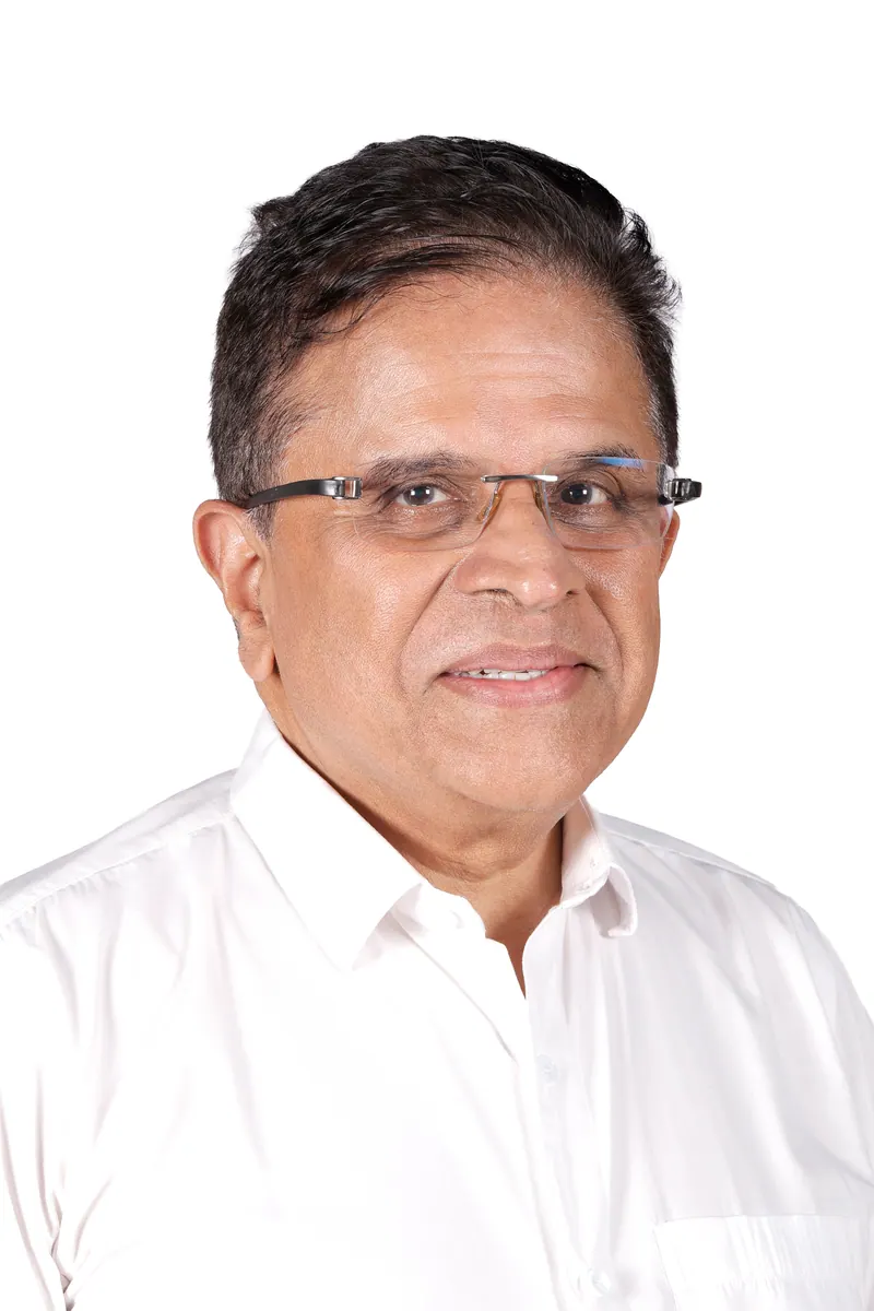Senior executive with glasses in a white shirt, corporate headshot on a clean white background in Pune
